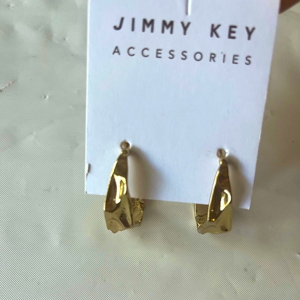 New Jimmy Key gold tone round shape earrings .